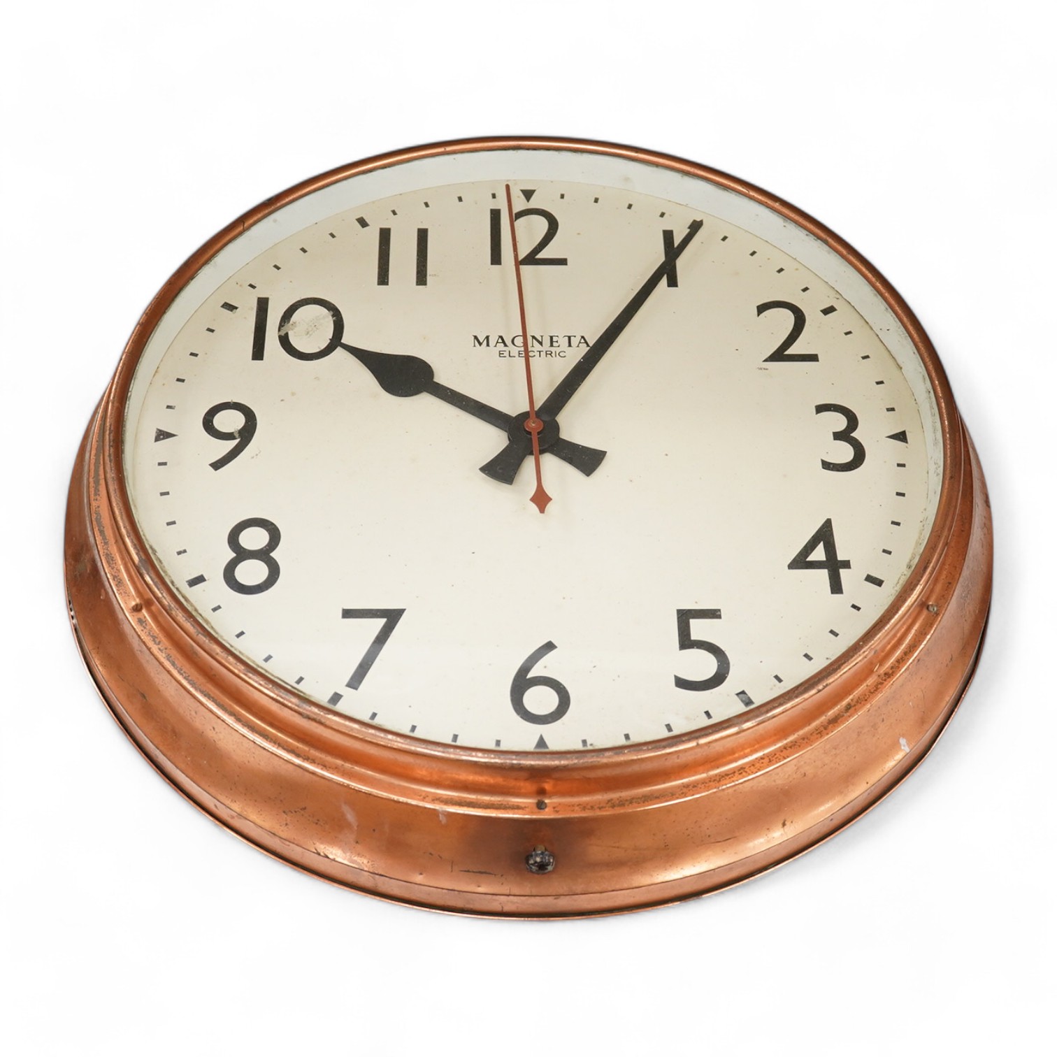 A copper Magneta Electric wall clock, with Arabic dial 53cm in diameter. Condition - fair/good, untested